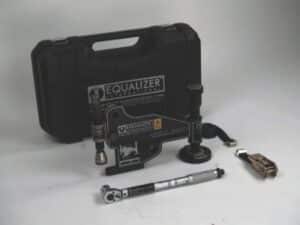 FA4TM mechanical flange spreading kit by Equalizer International, including wedge‑style spreader, torque wrench, ratchet strap, and carrying case for controlled flange separation in industrial piping systems.
